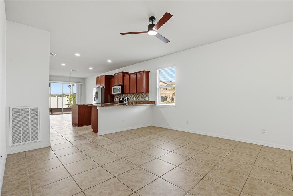 1724 Passage Key Lane Ruskin, FL 33570 - Photo 9 of 46 a view of kitchen with furniture and microwave