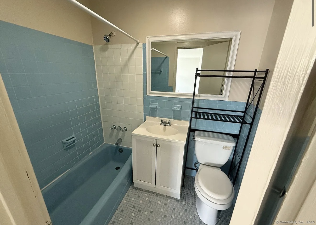 52 McKinley Avenue, Unit 9 Bridgeport, CT 06606 - Photo 3 of 3 a bathroom with a toilet and a sink