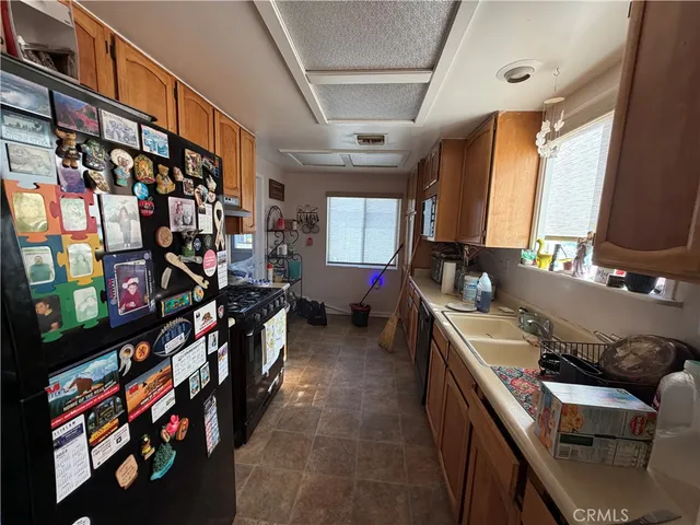 a kitchen that has a lot of cabinets in it