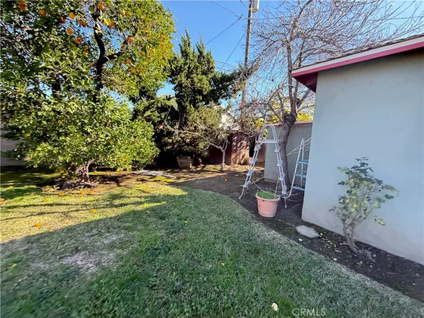 a view of a backyard with swimming pool