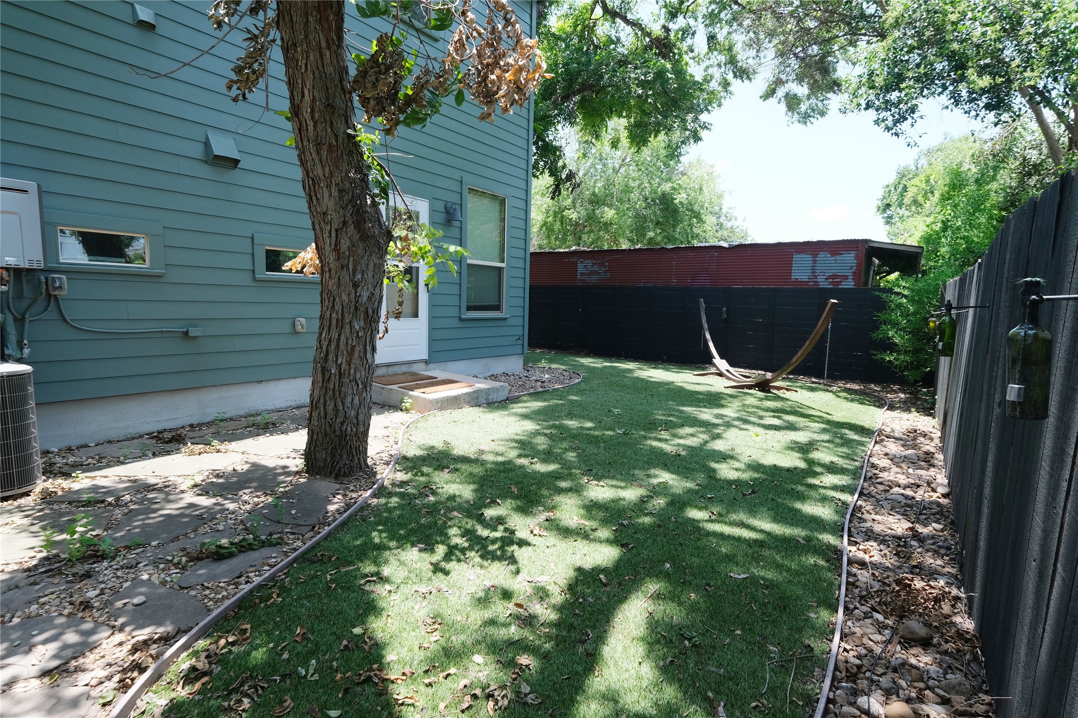 604 Allen Street, Unit 104 Austin, TX 78702 - Photo 7 of 16 a backyard of a house with lots of green space