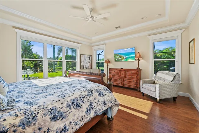 a bedroom with a bed a couch and a window