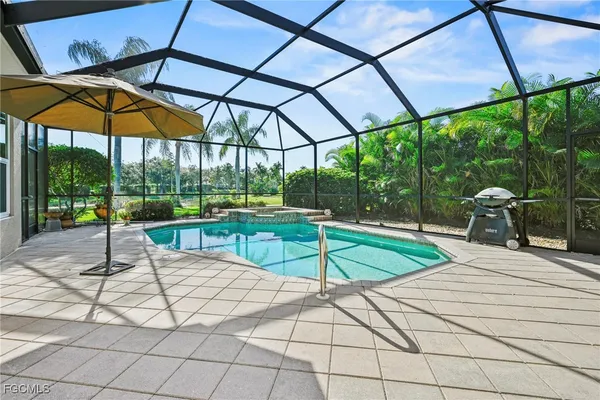 a view of a backyard with under a umbrella