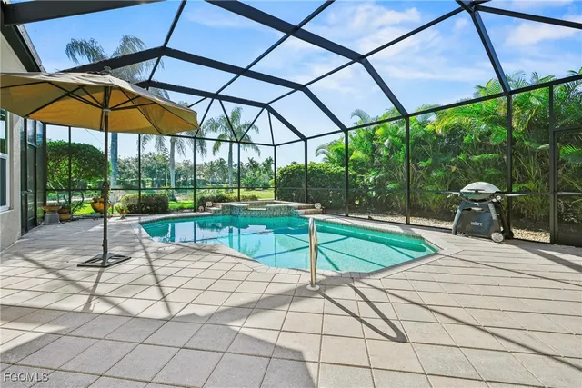 a view of a backyard with under a umbrella