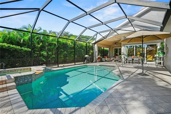 a view of a swimming pool with a patio