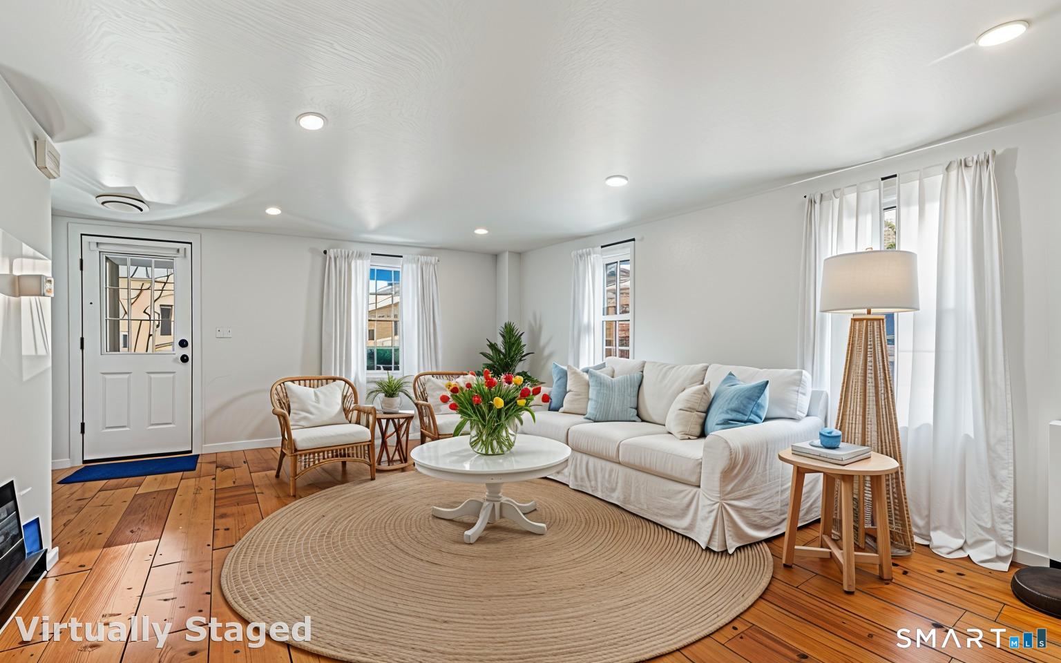 53 Maple Street Darien, CT 06820 - Photo 25 of 33 Design note - grounded in calmness with a sisal rug and wispy shear curtains.