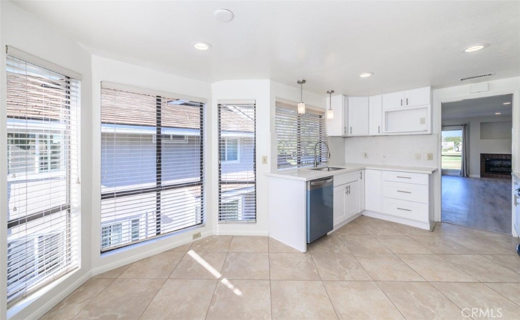 42 Lakeview Irvine, CA 92604 - Photo 14 of 46 a large white kitchen with a large window