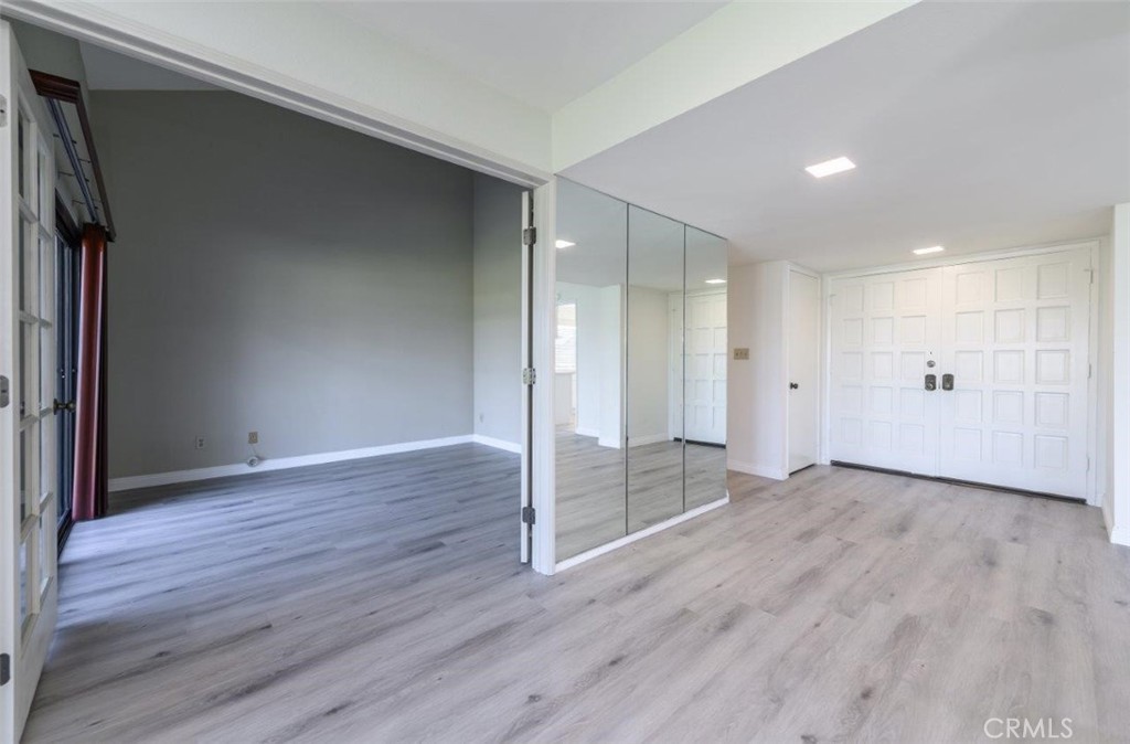42 Lakeview Irvine, CA 92604 - Photo 19 of 46 a view of an empty room with wooden floor