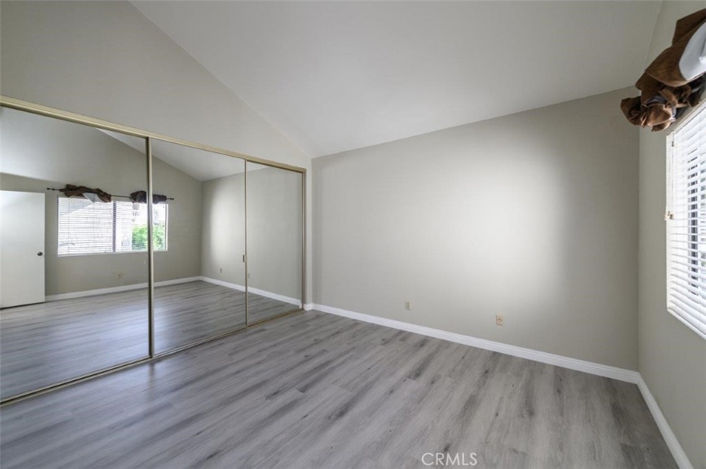42 Lakeview Irvine, CA 92604 - Photo 21 of 46 an empty room with wooden floor and window