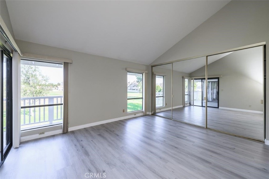42 Lakeview Irvine, CA 92604 - Photo 22 of 46 an empty room with wooden floor and windows