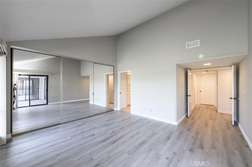 42 Lakeview Irvine, CA 92604 - Photo 23 of 46 a view of a big room with wooden floor and windows
