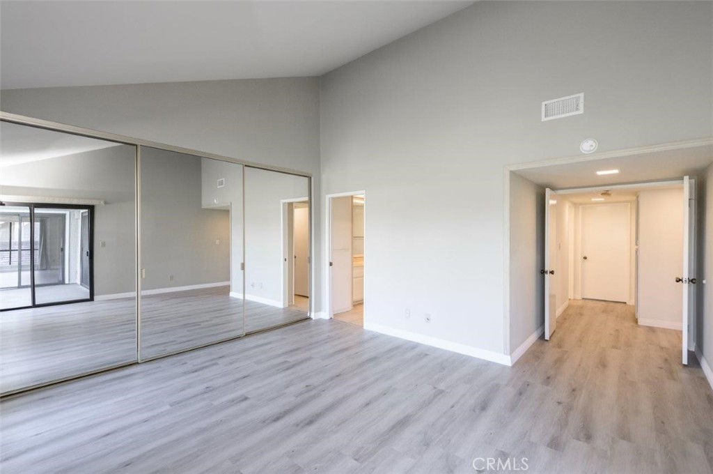 42 Lakeview Irvine, CA 92604 - Photo 24 of 46 a view of an empty room with wooden floor