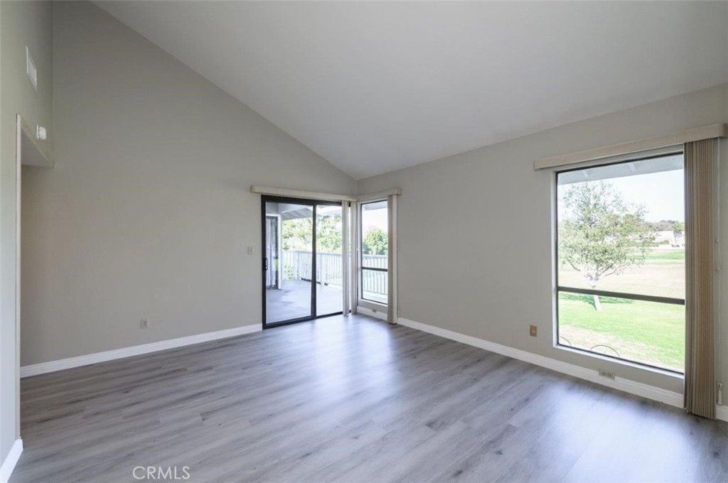 42 Lakeview Irvine, CA 92604 - Photo 26 of 46 a view of an empty room with wooden floor and a window