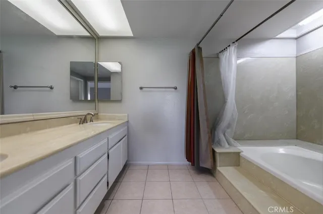 a bathroom with a bathtub and a sink