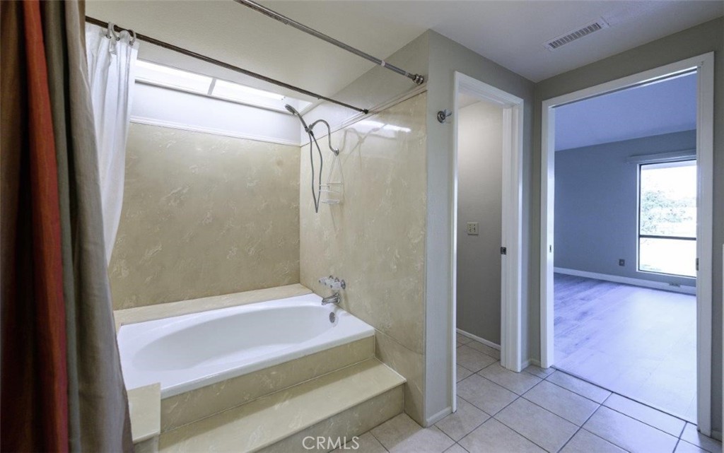 42 Lakeview Irvine, CA 92604 - Photo 29 of 46 a bathroom with a bathtub and a shower