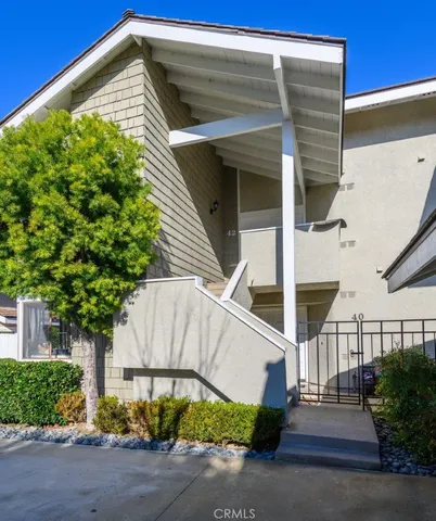 a view of a house with a small yard