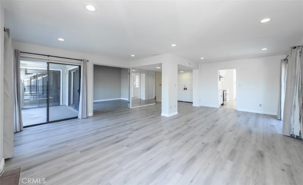 42 Lakeview Irvine, CA 92604 - Photo 5 of 46 a view of an empty room with wooden floor and door