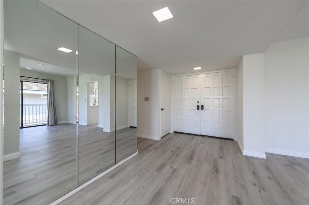42 Lakeview Irvine, CA 92604 - Photo 7 of 46 a view of wooden floor and windows in an empty room