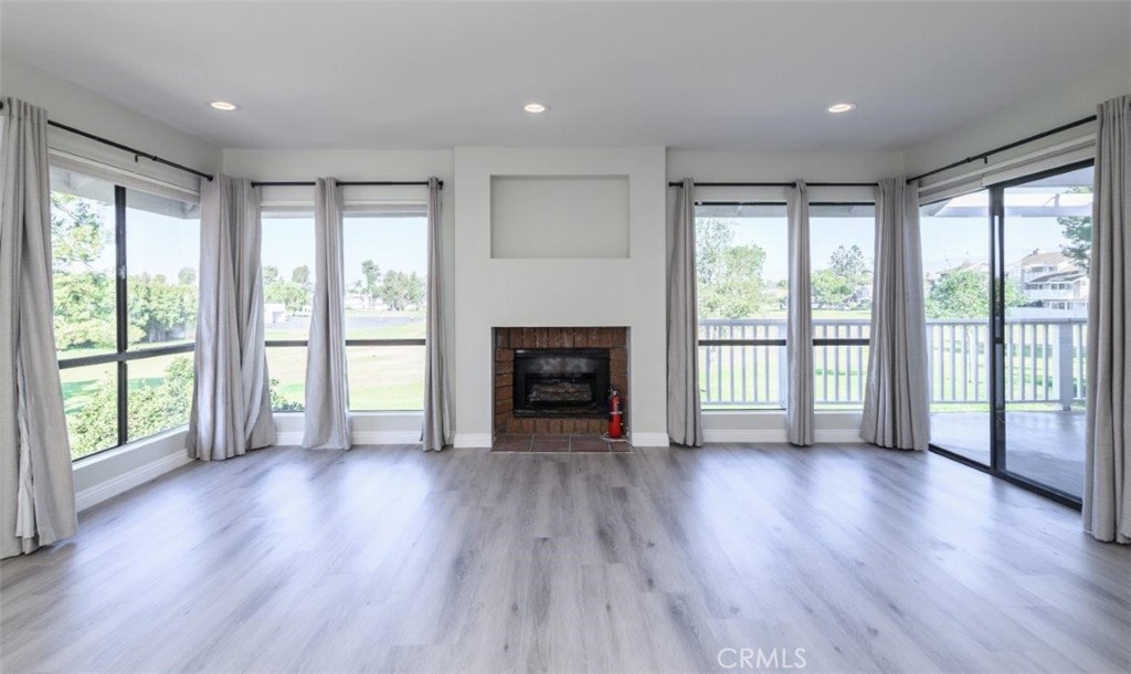 42 Lakeview Irvine, CA 92604 - Photo 9 of 46 a view of an empty room with wooden floor and a window