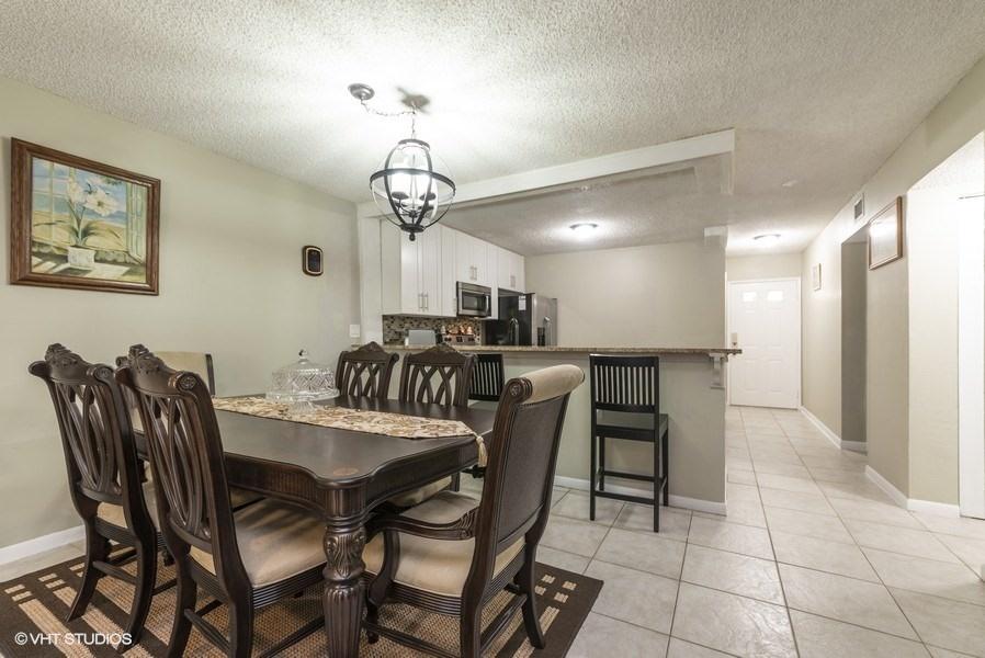 18940 Stewart Circle, Unit 8 Boca Raton, FL 33496 - Photo 11 of 22 09_18940StewartCr_8_92_KitchenDiningRoom