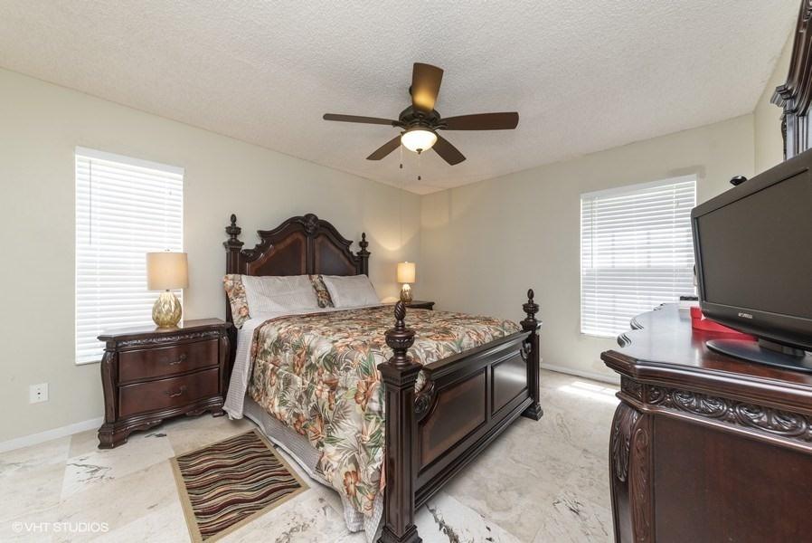 18940 Stewart Circle, Unit 8 Boca Raton, FL 33496 - Photo 15 of 22 13_18940StewartCr_8_14_MasterBedroom_Low