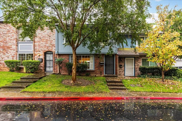 a front view of a house with garden