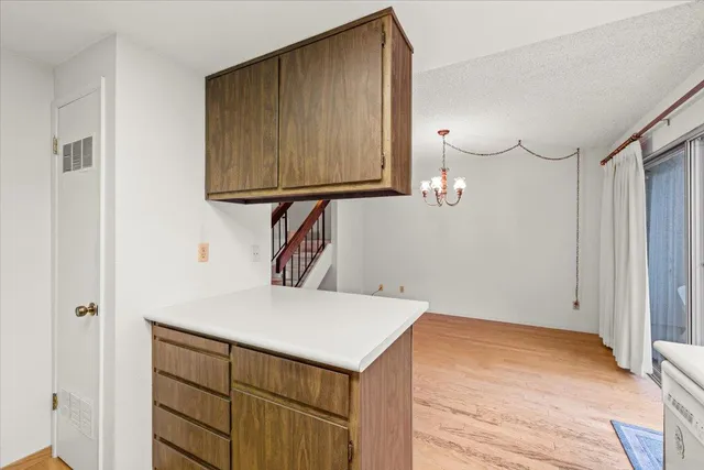 a kitchen with a stove a sink and a microwave