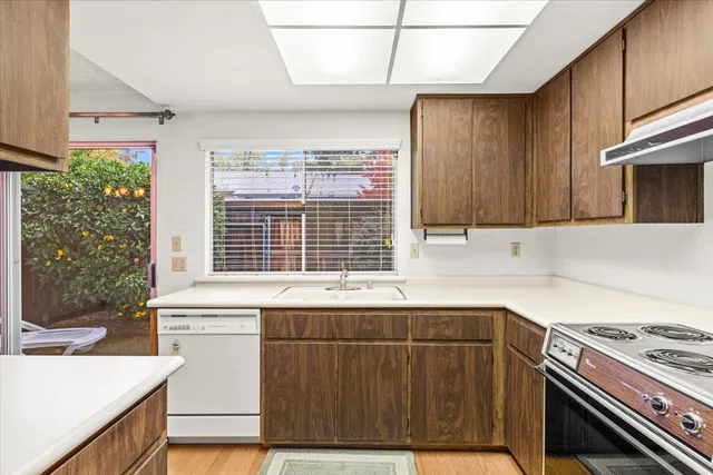 a view of an entryway with wooden floor