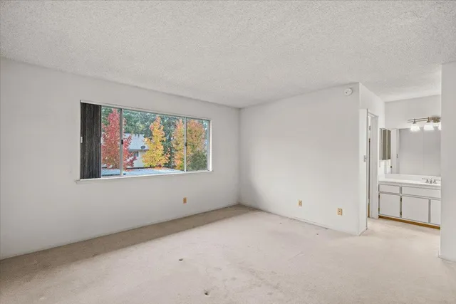 a bathroom with a sink vanity and mirror