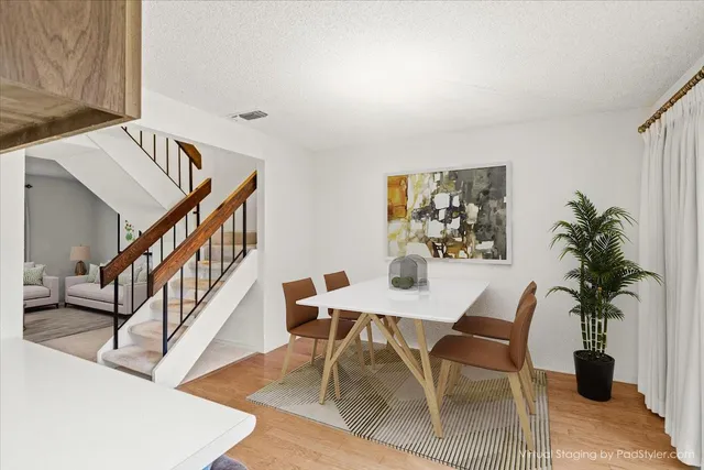 a view of a livingroom with furniture window and wooden floor