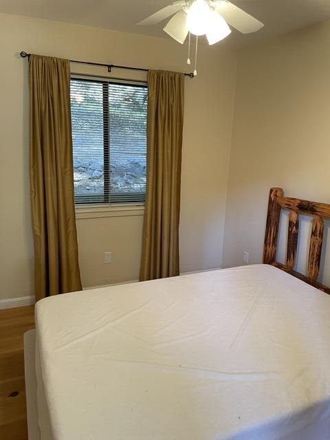 46967 Blue Ridge Drive Springville, CA 93265 - Photo 73 of 83 a bedroom with a bed and a chandelier
