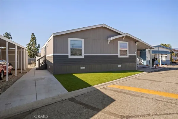 a front view of a house with yard
