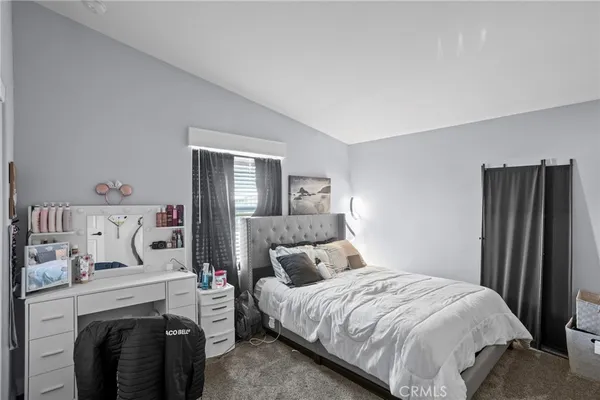 a bedroom with furniture and a couch