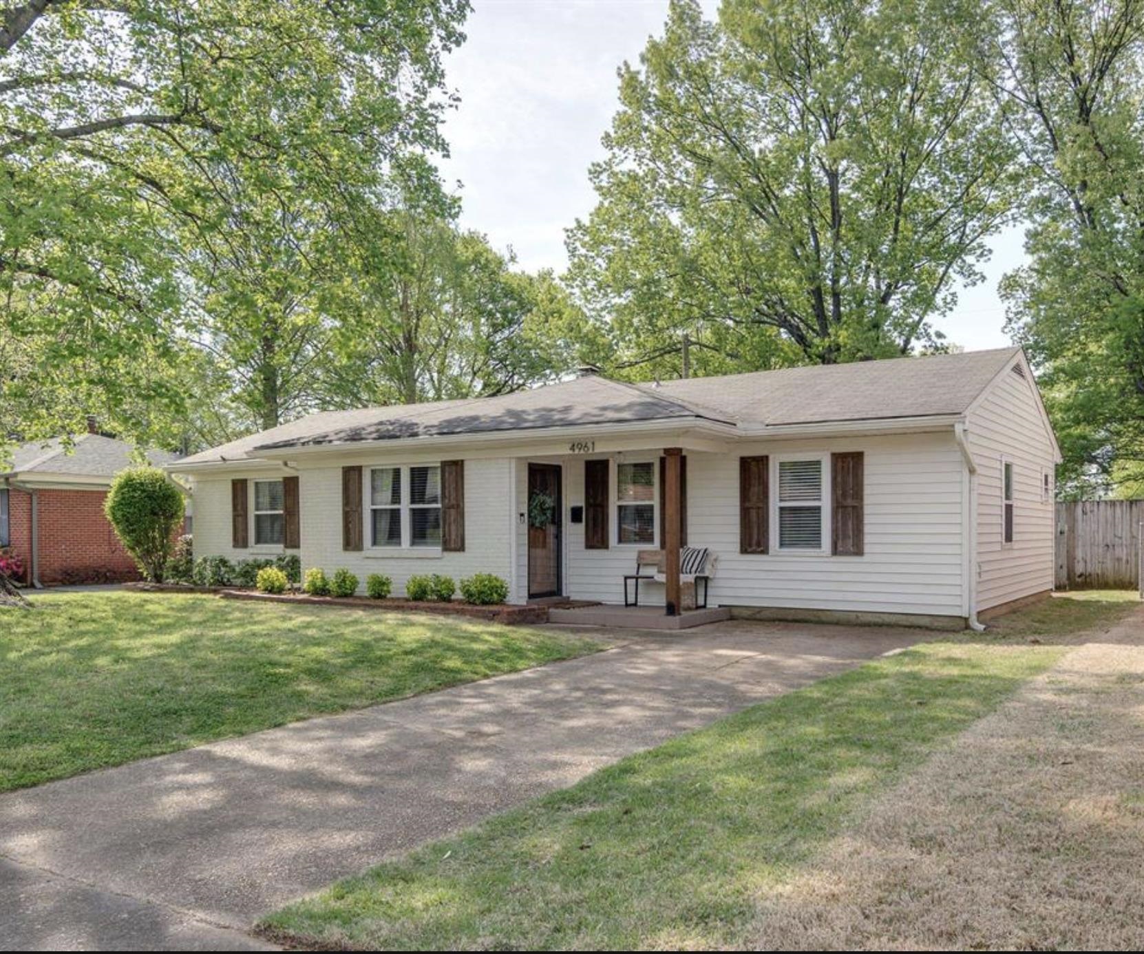 4961 Sea Isle Road Memphis, TN 38117 - Photo 1 of 29 Ranch-style home featuring a front yard, driveway, fence, and covered porch