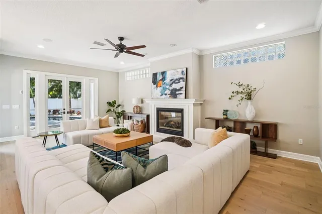 a view of a livingroom with furniture window and wooden floor