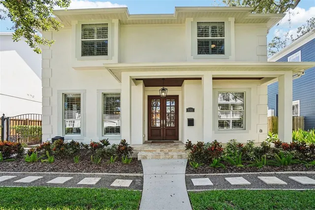 a front view of a house with garden