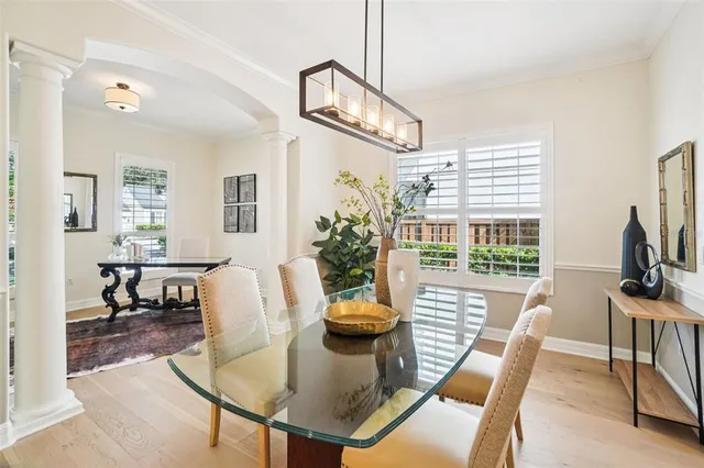 a bathroom with a granite countertop sink a toilet a mirror and shower