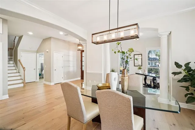 a bathroom with a granite countertop sink a mirror and a potted plant