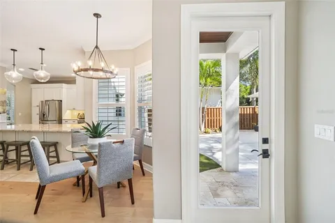 a bedroom with a bed and a lamp with the dresser