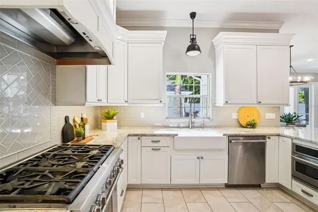 a utility room with a sink a washer and dryer