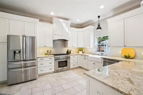 a bedroom with a bed and a large mirror
