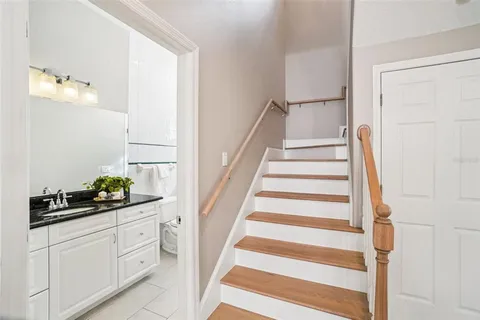 a bathroom with a sink a mirror and a shower