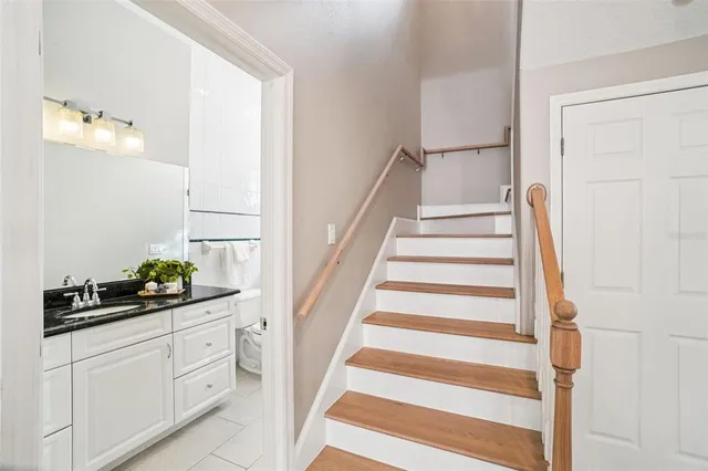 a bathroom with a sink a mirror and a shower