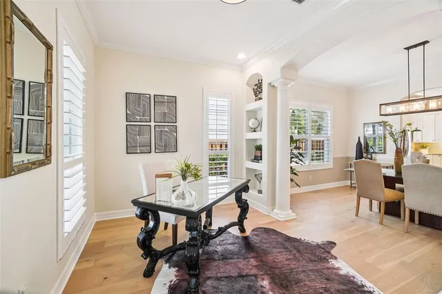 a white bench sitting in front of a building