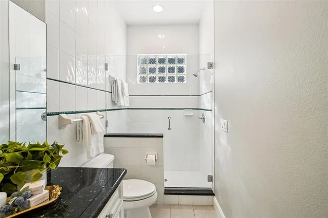 a view of a house with backyard sitting area and garden