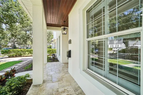 a living room with furniture ceiling fan and a fireplace