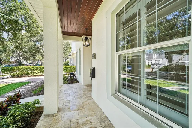 a living room with furniture ceiling fan and a fireplace