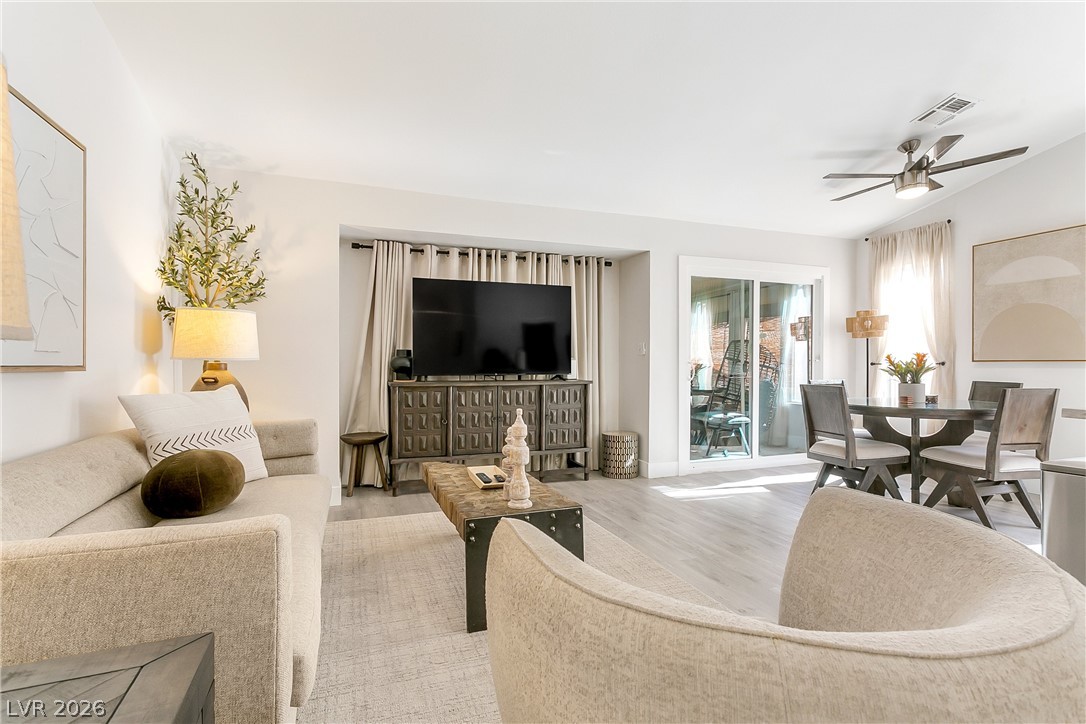 101 Beaver Ridge Avenue North Las Vegas, NV 89031 - Photo 3 of 42 An inviting, naturally illuminated living area and dining space with access to outdoor leisure.