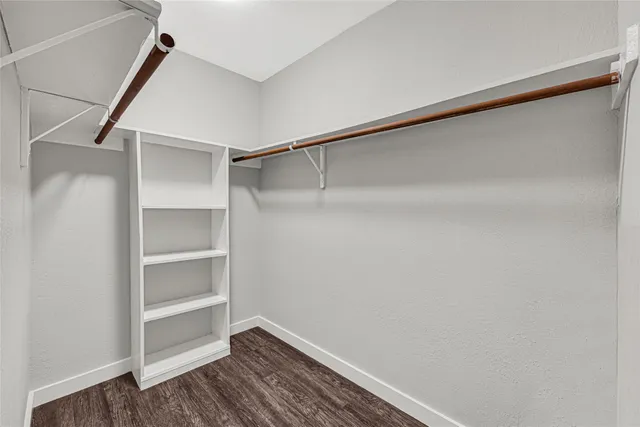 a view of an empty walk in closet