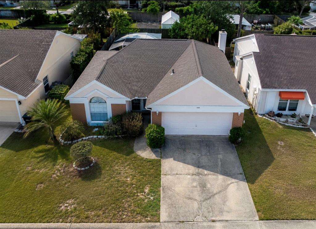 338 Mantis Loop Apopka, FL 32703 - Photo 2 of 11 an aerial view of a house with swimming pool